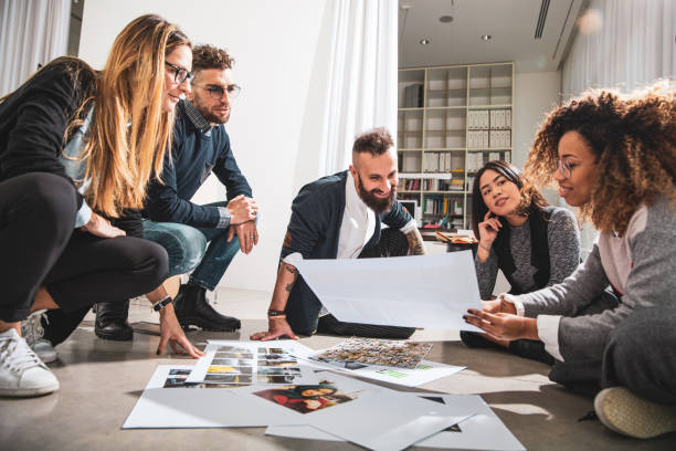 istock Office colleagues working and brainstorming as a Team choosing the project main image 1161773545