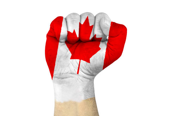 istock canada flag and fist 1161773703