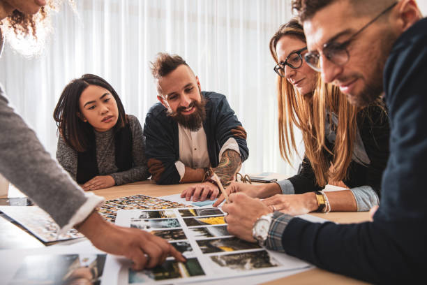 istock Office colleagues working and brainstorming as a Team choosing the project main image 1161773959