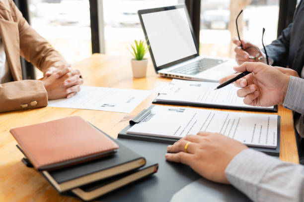 istock Midsection Of Business People At Interview 1161774898