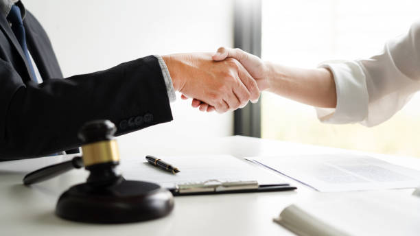 istock Cropped Image Of Lawyer And Customer Shaking Hands 1161776652