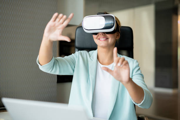 istock Happy young creative woman in smartcasual pointing at virtual display 1161779868