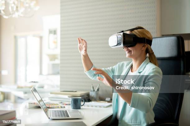 Young Female Employee In Vr Goggle Attenting Virtual Training Stock Photo - Download Image Now