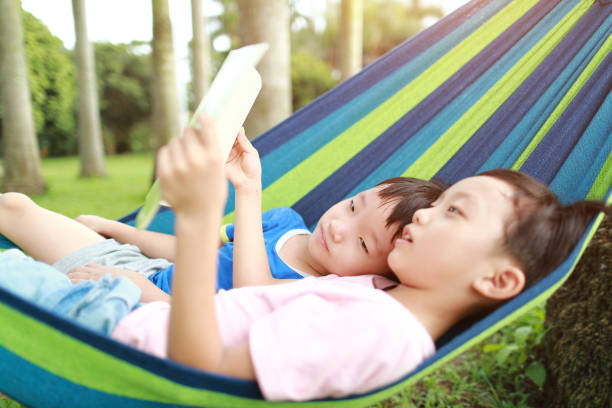 istock Little boy have a rest in a hammock 1161779893