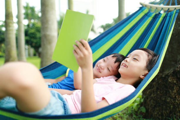 istock Little boy have a rest in a hammock 1161779917