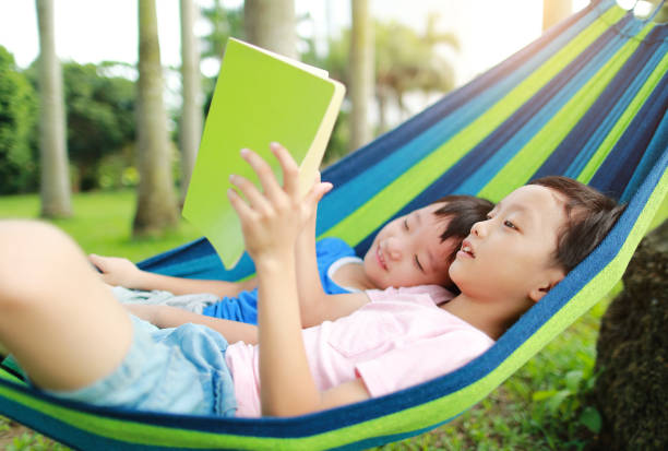 istock Little boy have a rest in a hammock 1161780026