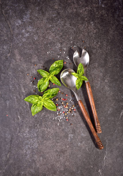 istock Vintage spoons laying on the stone desk 1161785248