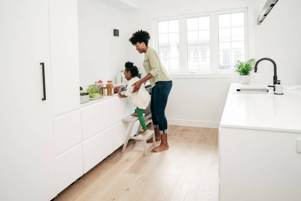 istock Mom and daughter in the kitchen 1161787769
