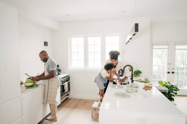 istock Dad, Mom and daughter in the kitchen 1161787780