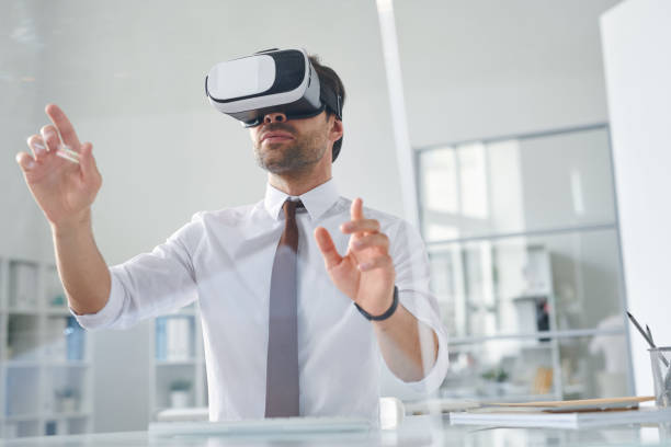 Contemporary young businessman making virtual presentation