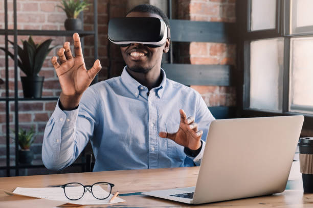 istock African businessman exploring opportunities of virtual reality in loft office, using VR headset 1161788035