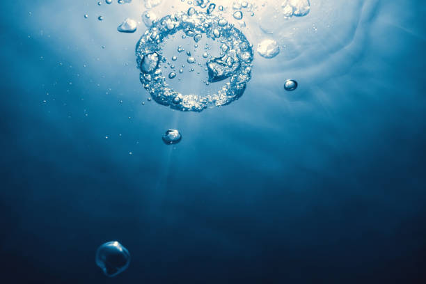 Bubble ring Underwater ascends towards the sun.