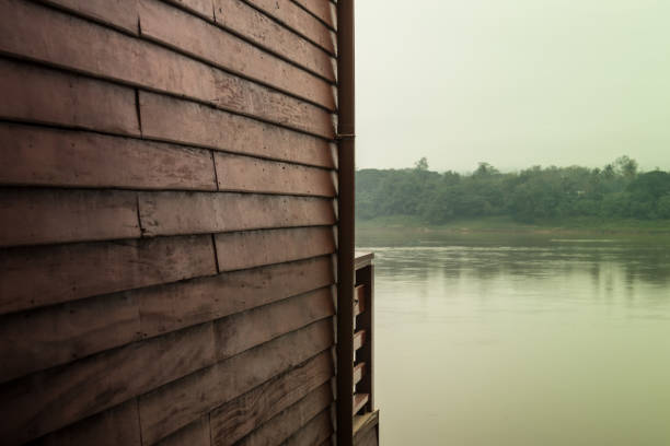 Old home with wood wall vintage style beside the river.