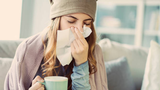 Young woman suffering from cold Young woman suffering from cold handkerchief photos stock pictures, royalty-free photos & images