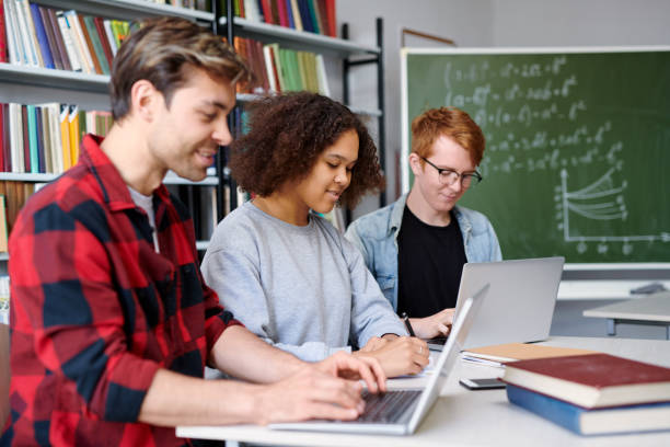 istock Group of young college students preparing for forthcoming seminar 1161792629