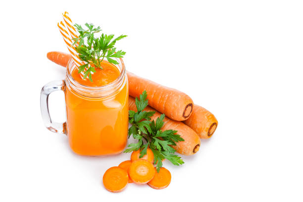 istock Healthy drink: carrot juice isolated on white background with copy space 1161796279