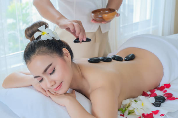 istock Women with Therapeutic stones on her back 1161797790