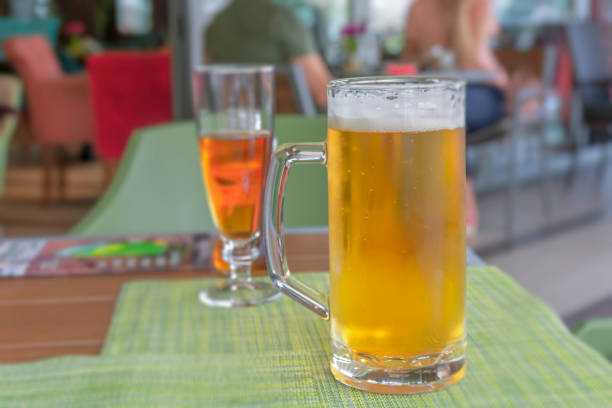 istock Glass of light beer on a restaurant table close 1161800207