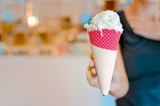 istock Green ice cream cone with lime and basil flavor 1161800355