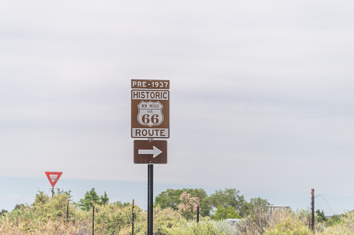 Santa Fe, USA Historic highway route 66 sign near city with pre 1937 text and arrow direction to town