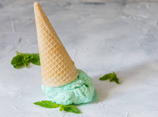 a cone of pistachio or mint ice cream stock photo