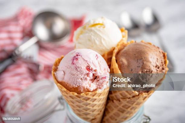 Strawberry Vanilla Chocolate Ice Cream With Waffle Cone On Marble Stone Backgrounds Stock Photo - Download Image Now