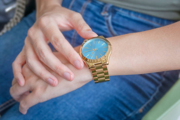 istock Woman looking at her smart watch 1161806792