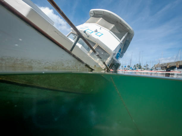 istock Split-Shot of A Half-Sunken Boat 1161806834