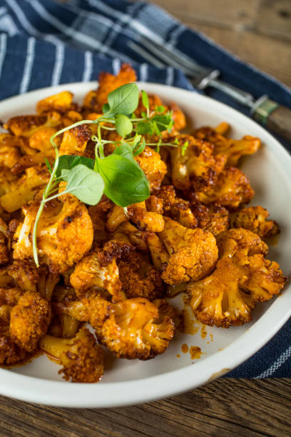 istock Cauliflower rosettes in a herbal marinade. 1161811465