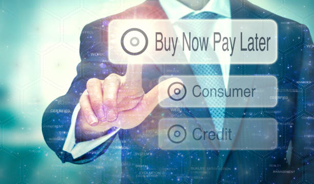 Futuristic display with a Buy Now Pay Later concept written on it. A businessman selecting a button on a futuristic display with a Buy Now Pay Later concept written on it. deadline photos stock pictures, royalty-free photos & images