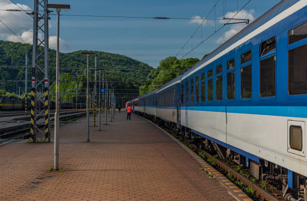 istock Night train with sleeping coaches and car motorcycle coaches Kysak station 1161814907