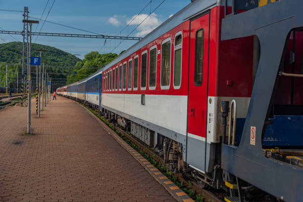 istock Night train with sleeping coaches and car motorcycle coaches Kysak station 1161815003