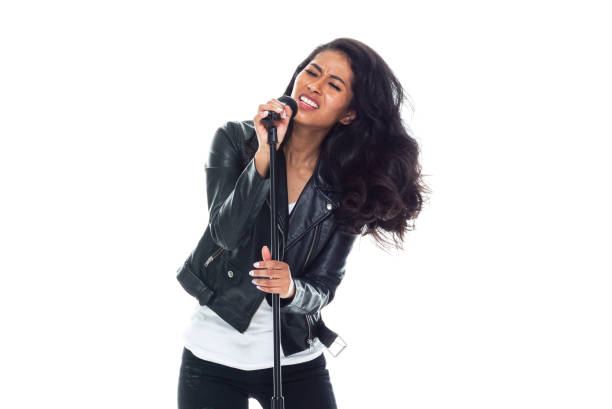 istock Bautiful woman wearing a leather jacket and singing like a rock star 1161815155