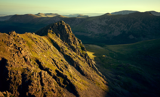 Sunrise over Ennerdale from Scoat Fell with views of Steeple In the English Lake District, UK.