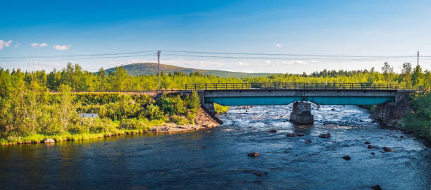 Railway bridge over the Rautas River in Sweden Picturesque panorama view of the railway bridge over the Rautas River near Rautas village in Kiruna municipality, Norrbotten, Sweden. norrbotten province stock pictures, royalty-free photos & images