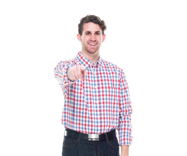 istock Attractive young man wearing a checked shirt and jeans - pointing 1161817291