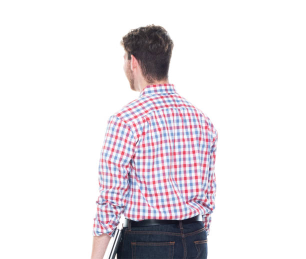 istock Attractive young man wearing a checked shirt and jeans - using a laptop 1161817292
