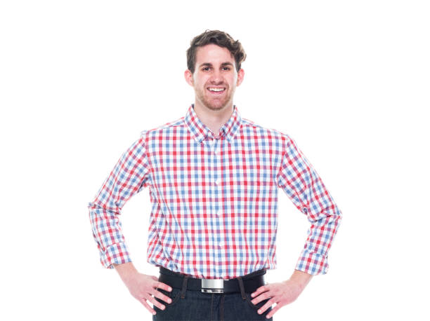 istock Attractive young man wearing a checked shirt and jeans - hands on hips 1161817308