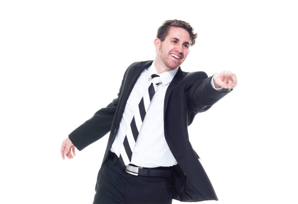 istock Good looking businessman wearing a dark suit - front view, pointing and touching 1161817318