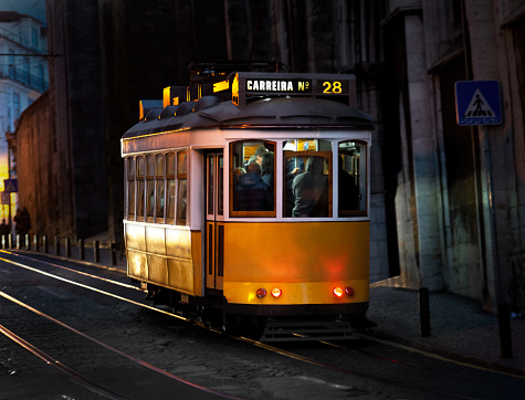 Night view of yellow tram in Lisboa, Portugal