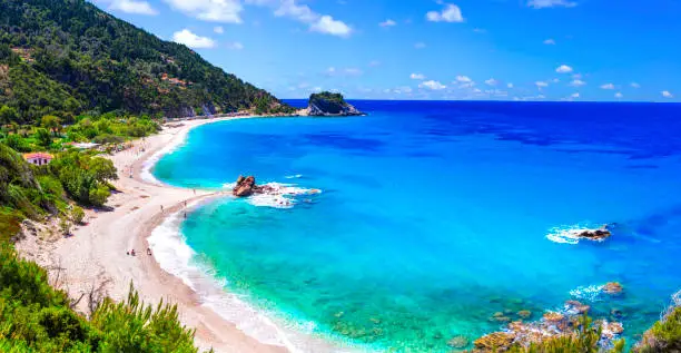 Photo of Best beaches of Samos island - scenic  Potami with turquoise waters,  near Karlovasi town, Greece