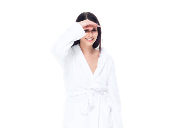 istock Cute Brazilian female wearing white bathrobe - searching 1161820483