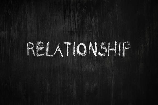 istock Relationship word handwritten on black wood background. 1161823272