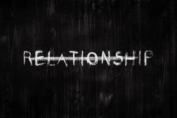istock Relationship word crossed out on black wood background. 1161823302