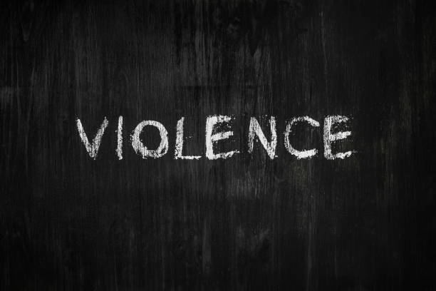 istock Violence word handwritten on black wood background. 1161823303