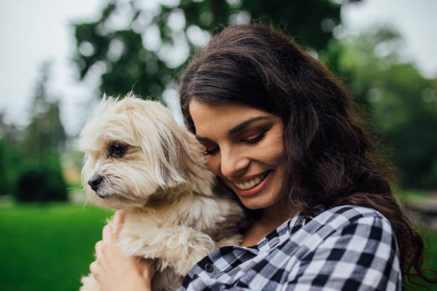 istock Girl with a puppy in her hand 1161823398