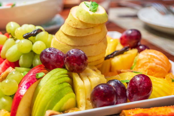 istock Pear, cherry and other healthy fruits on the table. 1161825303