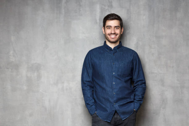 istock Man smiling happily dressed in casual clothes isolated on grey background 1161827711