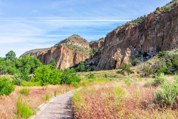 Main Loop path trail in Bandelier National Monument in New Mexico in Los Alamos with canyon cliffs Main Loop path trail in Bandelier National Monument in New Mexico in Los Alamos with canyon cliffs los alamos new mexico stock pictures, royalty-free photos & images
