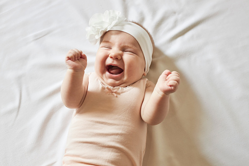 Cute little baby girl laughing